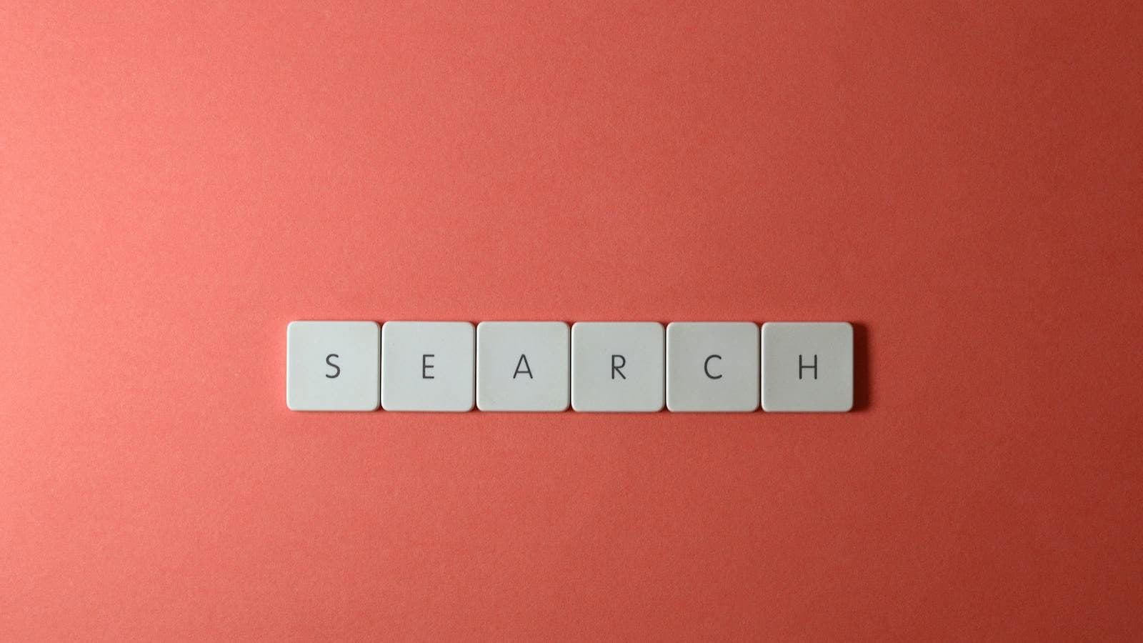Close-Up Shot of Keys on a Red Surface