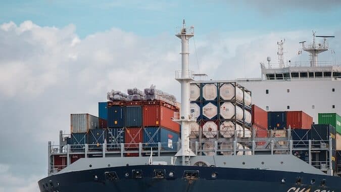 blue and red boat during daytime